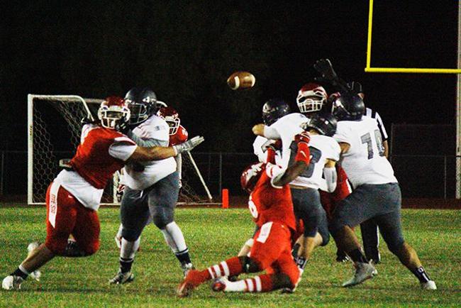 Rodney Jones, Jr sacks the Pima quarterback, forcing a fumble and giving the ball (photo by Jacob Dewald)