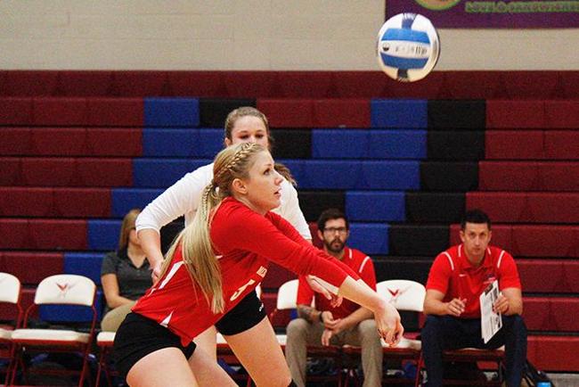 Megan Derr returns a serve against South Mountain(photo by Jacob Dewald)